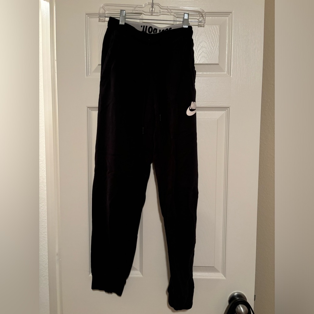 Women’s Black Nike joggers.